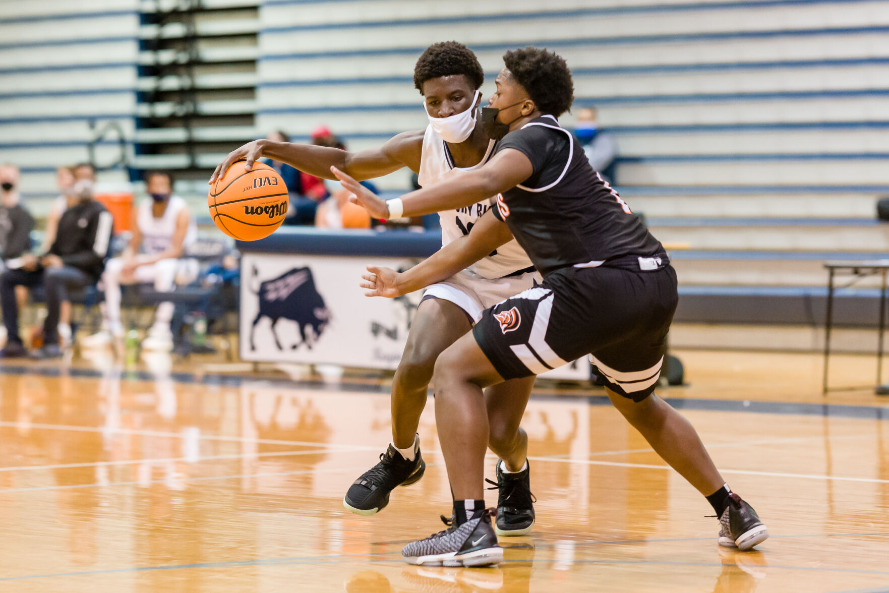Boys Basketball: Hickory Ridge RaginÕ Bulls defeated the Northwest Cabarrus Trojans 64-56.